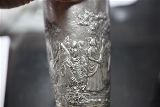 Two Indian white metal beakers, each embossed with scenes of women making offerings to Lord Shiva